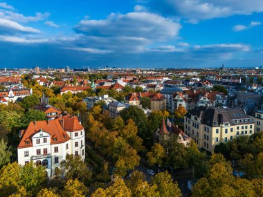 The skyline features a mix of historic landmarks and modern architecture, showcasing the Bavarian capital s cultural and economic significance.