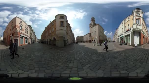 Man in Yellow Jacket is Walking by Paving Stone Among Low-Rise Buildings Espherical Panorama Vídeo vr Vídeo 360 Sunny Spring Day Blue Sky White Clouds — Vídeo de Stock