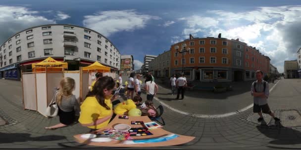 360 Vr Video Fair on Square City Day Opole Aqua-Makeup Kiosk Kid Comes and Choosing a Picture Cityscape People Have a Rest in Sunny Day Blue Sky Clouds — стоковое видео