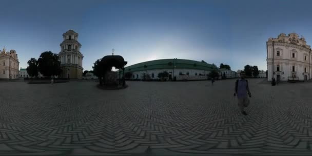 360Vr Video Man Near Bell Tower Piece of Old Wall Cobblestone Kyiv Pechersk Lavra Square Tourist is Looking at Historical Buildings Dormition Cathedral — Stock Video