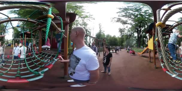 360vr video people at multi level play zone playground kids are climbing up walking running have fun on sports ground child development center outdoor — Stockvideo