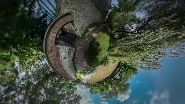 Little Tiny Planet 360 Degree Abandoned Building on a River Bank Sunny Summer Day in Park Willow Tree Branches Trees on Opposite Bank of River Blue Sky — Stock Video