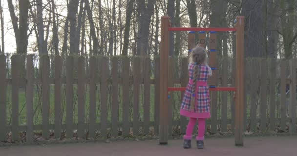 Girl Plays With Herself in a Kindergarten — Stock Video