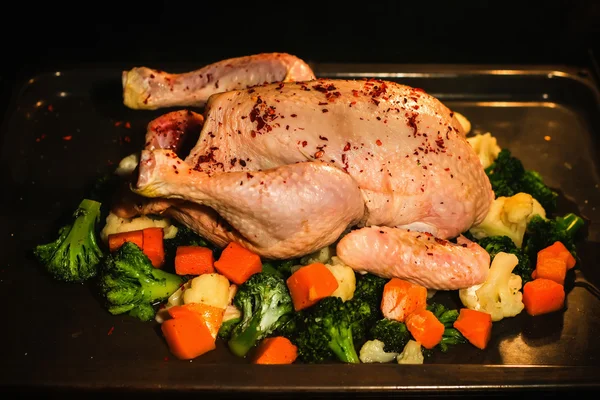Raw chicken in oven ready for cooking — Stock Photo, Image