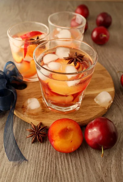 slivovitz (plum brandy) with ice and fresh plums