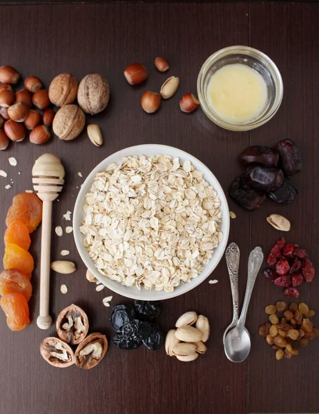 stock image Granola bars ingredients on wood background, top view