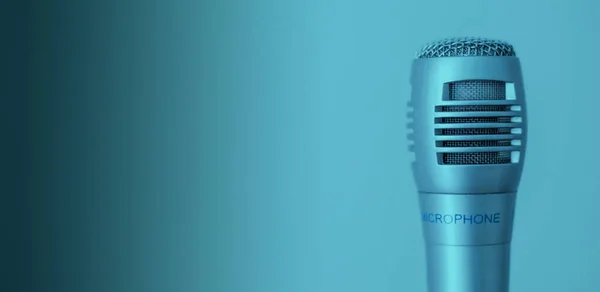 Clubhouse podcast blue - green banner with studio microphone and light wave. Professional broadcast microphone recording sound with waveform signal on blue green background