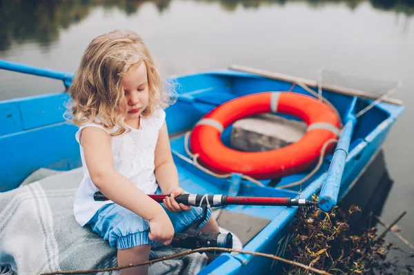 Little girl in the boat — Stock Photo, Image
