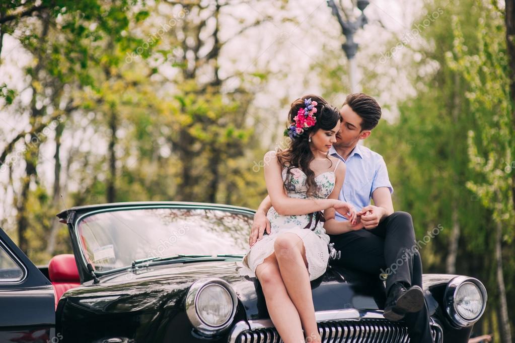 Free Photos - A Man And A Woman Standing Together In A Car Showroom. They  Are Smiling And Hugging Each Other Close, Conveying A Sense Of Affection  And Happiness. The Couple Is