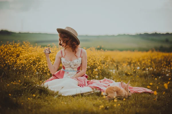 Beautiful redhead girl with rabbit — Stock Photo, Image