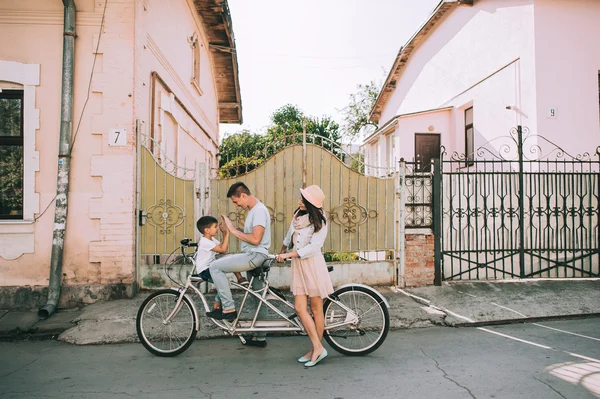 family having fun on double bike