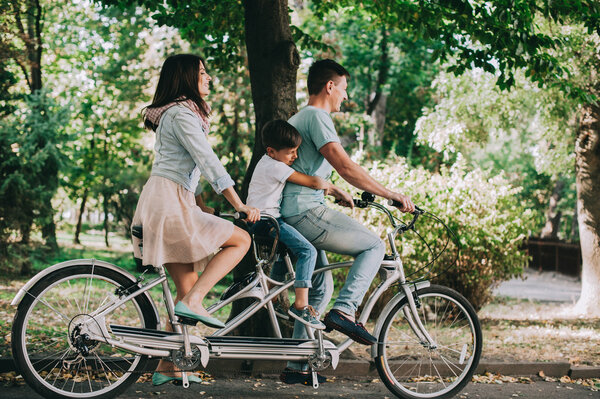 family having fun on double bike