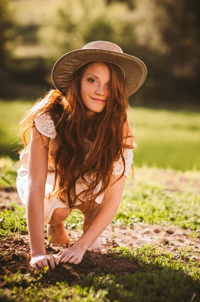 Young redhead woman in countryside — Stock Photo, Image