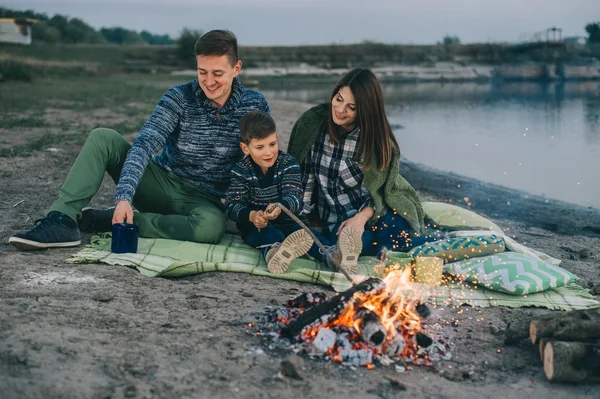 Happy young family sitting