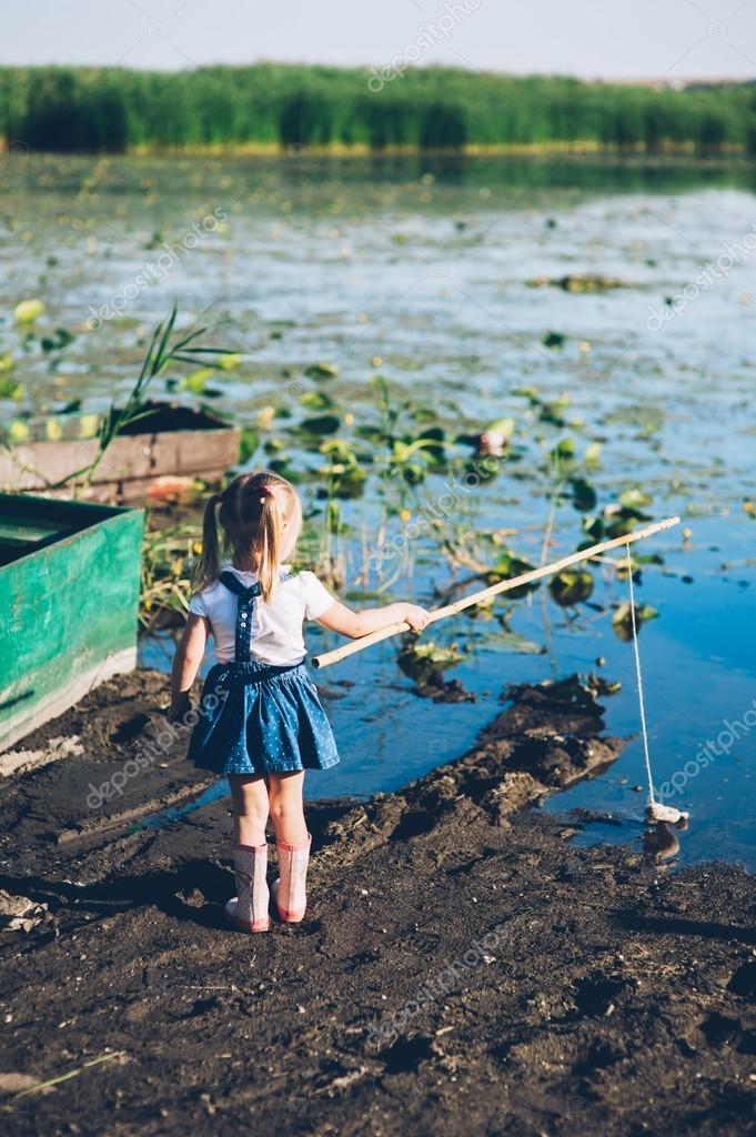Little girls fishing on lake Stock Photo by ©Photo_life 114207692