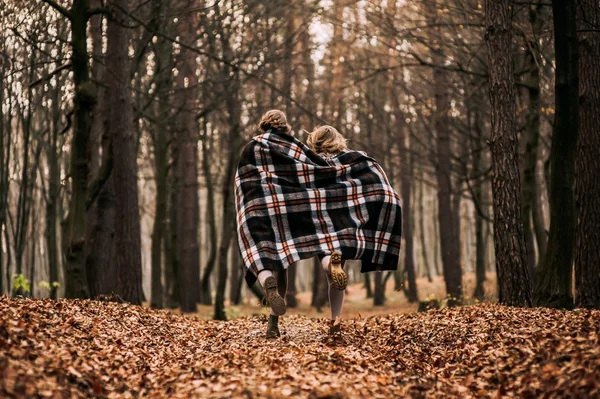 Sisters covered with blankets — Stock Photo, Image