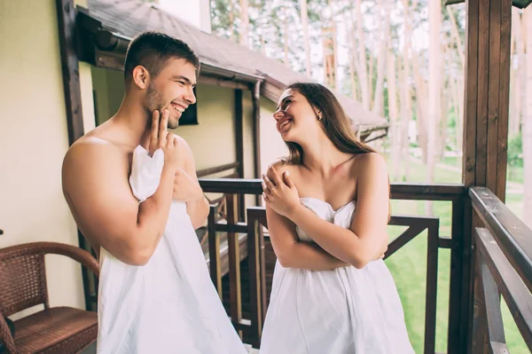 Couple in love wrapped in a towel — Stock Photo, Image