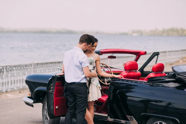 Young couple in vintage car