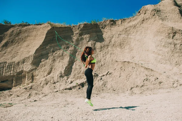 Sportive girl with jumping rope — Stock Photo, Image