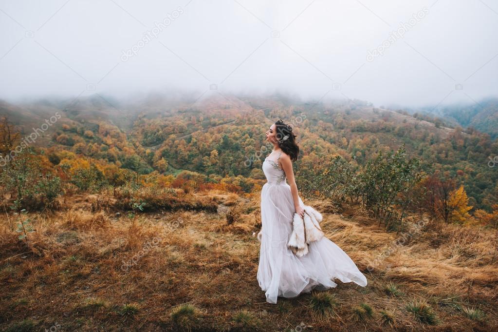 Beautiful bride in mountains
