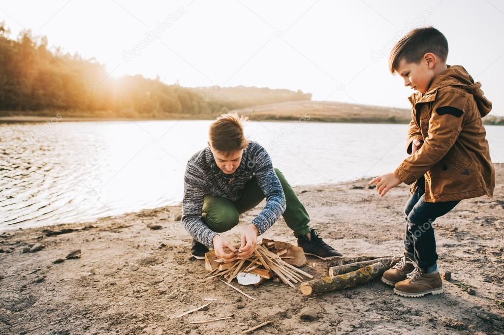 father and son burning fire