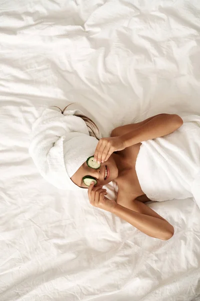 Beauty Treatments Cheerful Little Girl Wrapped White Towels Posing Cucumbers — Stock Photo, Image