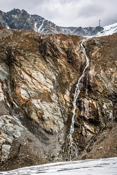 Waterfall in Austria mountains near glacier