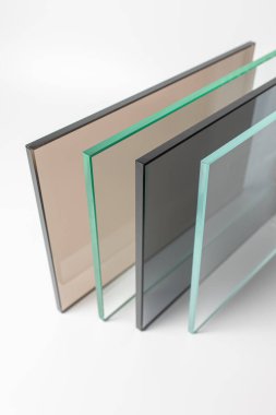 Sheets of Factory manufacturing tempered clear float glass panels cut to size clipart