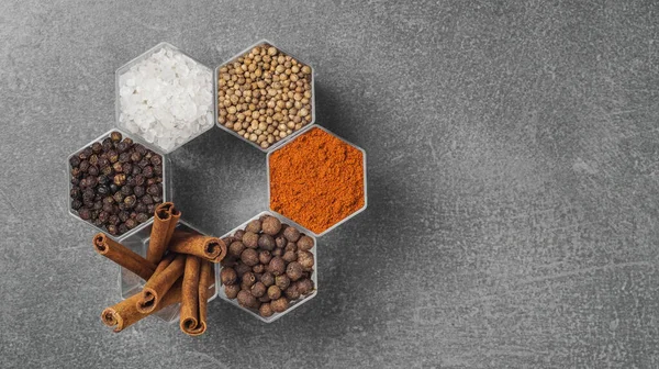 Various Spices Hexagonal Jars Appear Gray Stone Surface — Stock Photo, Image