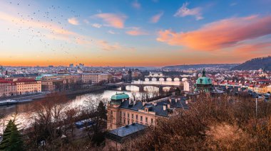 Cityscape of UNESCO world heritage site city Prague and bridges over Vltava river on early morning dawn. 