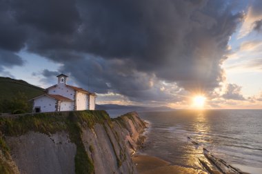 Beach of Itzurun in Zumaia at sunset. Basque Country clipart