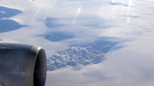 Greenland as seen from the sky, wing view with airplane turbine — Stock Photo, Image