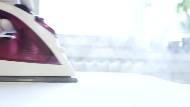 The Activity of a Housekeeper Who Irons Clean Laundry Using Electric Iron and Hot Steam — Stock Video