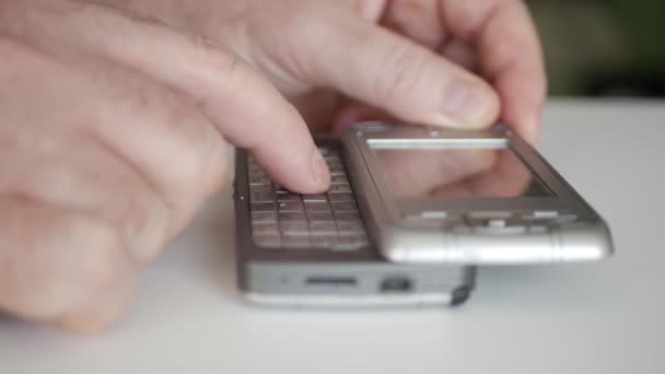 One Person Dialing a Phone Number Using Old Mobile Phone with Detachable Keypad. Man Text Using an Old Technology Cellphone. — Stock Video