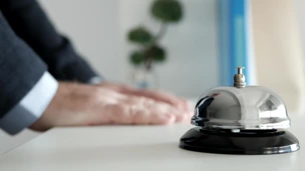 Tourist in the Reception of a Hotel Presses the Bell Button Calling the Receptionist — Stock Video