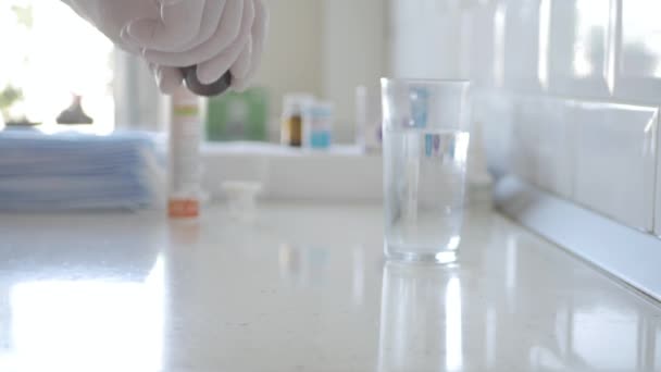 Pharmacist with Protective Gloves in Hands Takes Out Medical Pills from a Recipient. — Stock Video