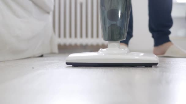 Man Using a Vacuum Cleaner in Household Activities to Clean the Floor from Dust and Dirt. — Stock Video