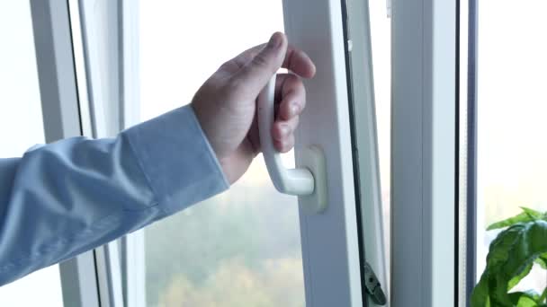 Man Closing a Window from the Office, in Swing Mode. Shutting Down a Double Glazed Window at Home. — Vídeo de Stock