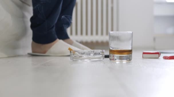 Alcoholic Person, Wearing Slippers, Drinking Alcohol and Smoking Cigarette Going to Sleep in the Bed. — Video