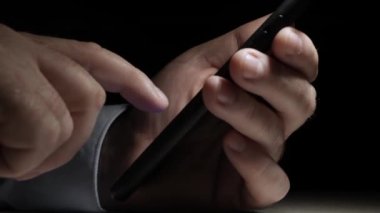 One Person Text on a Cell Phone, Send and Receive Messages Using Internet and Online App. A Man Dialing a Phone Number on Mobile.