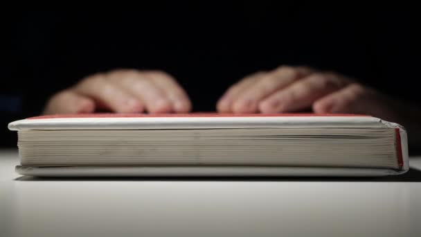 Bored Person, Late at Night, Making Nervous Gestures Keeping the Hands on a Book. — Stock Video