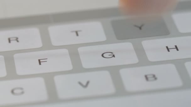 Fingers typing on a digital keyboard — Stock Video