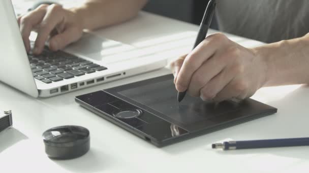 Side view man using his pen tablet — Stock Video