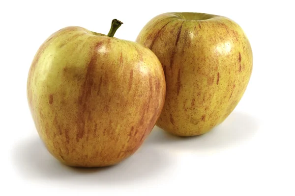 Dos manzanas sobre un fondo blanco — Foto de Stock