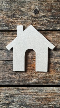 house made of wooden letters on a gray background