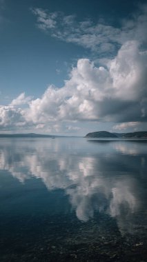 calm lake in a cloudy day.
