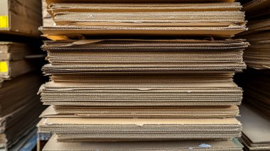 stack of cardboard on a wooden background