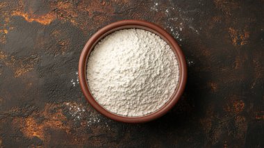 Masanın üstünde hindistan cevizi taneleri olan bir kase, üst manzara. sağlıklı gıda konsepti