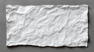 Gri arkaplan üzerine buruşmuş kağıt