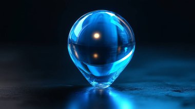 Mavi su damlası siyah cam yüzeye düşüyor, makro